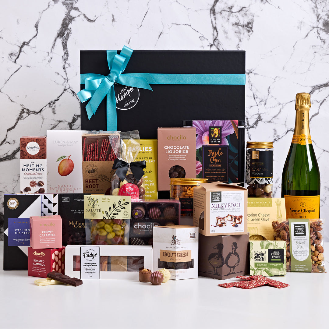 Veuve Team Celebration Hamper is a great hamper for a team celebration. This gift hamper includes everything needed for an office party making it an ideal corporate gift hamper choice for Christmas.