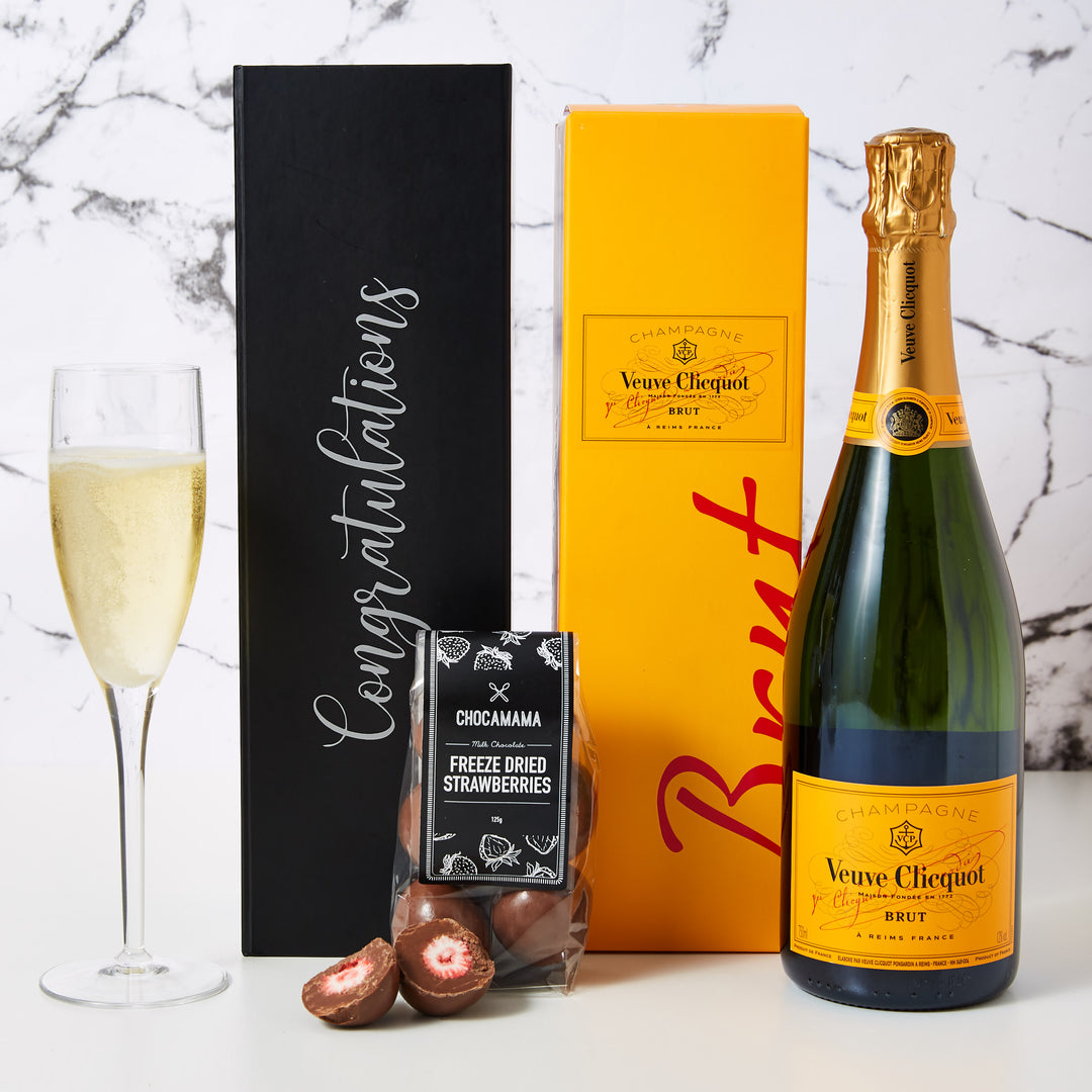 Congratulations Veuve Champagne Hamper comes personalised with Congratulations printed on the box. This hamper also includes a bottle of Veuve Cliquot and chocolate coasted freeze dried strawberries. Our Congratulations Veuve Champagne Hamper is the perfect way to say Congratulations to a colleague, staff or associate. It is also a wonderful settlement gift for new home buyers.