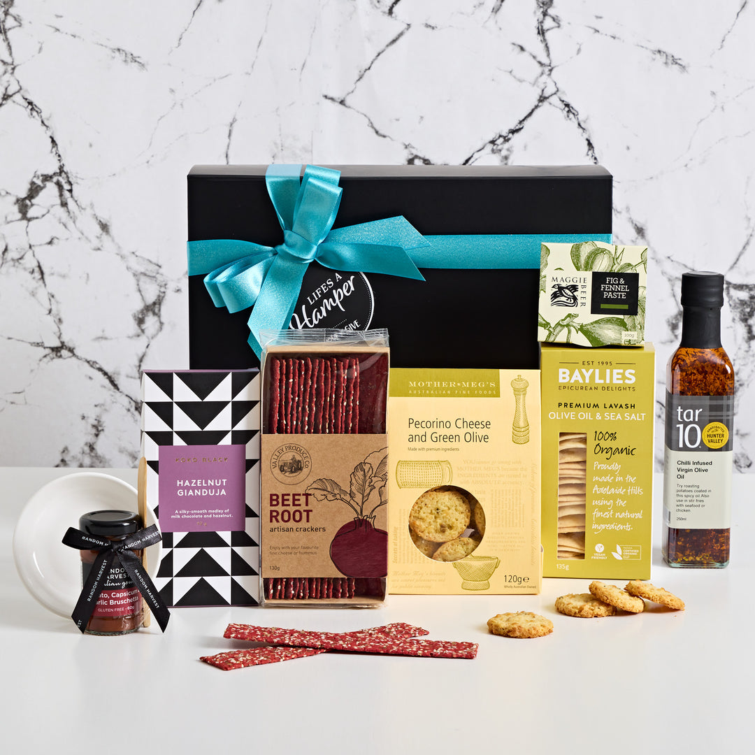 Mini Gourmet Hamper has lots of different treats that your recipient will love. It has a balance of sweet and savoury treats as well as a delicious chilli infused olive oil. Our mini gourmet hamper is the perfect birthday gift for a friend or a family member or even as a Christmas gift for clients and staff.