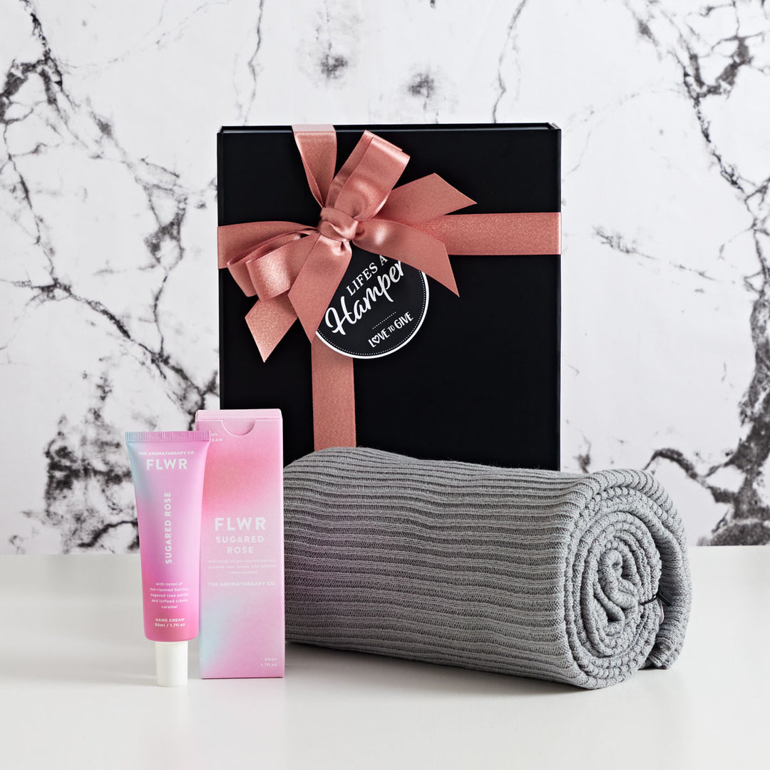 Snuggle Up Gift Hamper comes with Annabel Trends grey snood and The Aromatherapy Co Sugared Rose Hand Cream