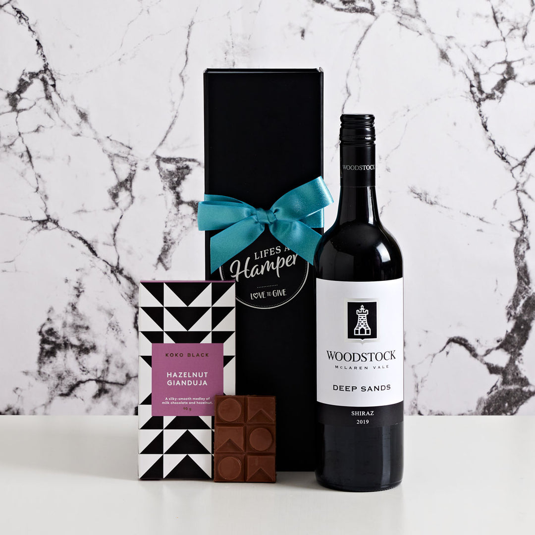 A bottle of Woodstock Shiraz and a delicious block of Koko Black Hazelnut Gianduja Chocolate.