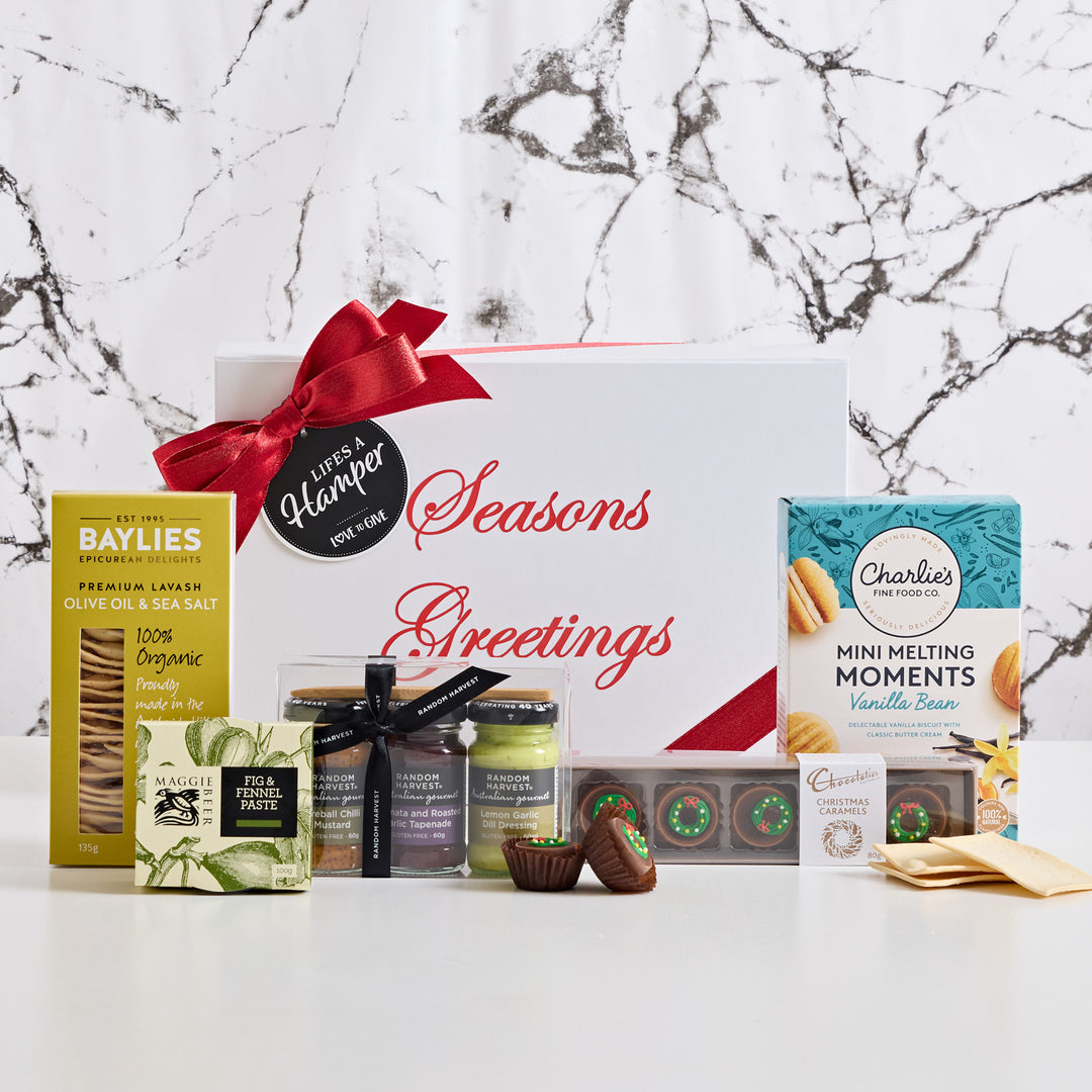 A gourmet Christmas gift hamper with a personalised with seasons greetings. Make this Christmas extra special with a luxury Christmas Hamper.