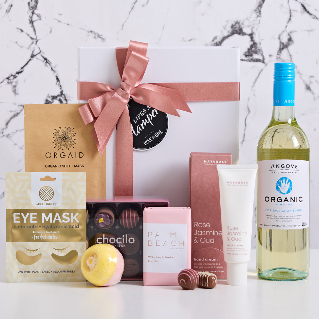 Angoves organic white wine along with chocilo chocoaltes and chewy caramels. Pamper products included in this hamper are orgaid face mask, 24K goddess eye mask, palm beach body bar and The Aromatherapy Co hand cream