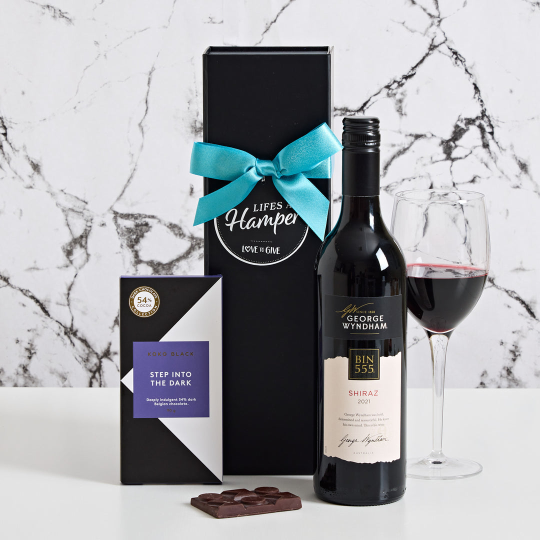 This red wine gift hamper includes a delightful red shiraz and a creamy Koko Black Step Into the Dark Chocolate Bar