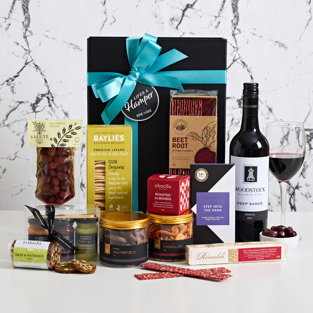 Gourmet Red Wine Hamper comes with a delicious Wynns Coonawarra Shiraz and gourmet treats that compliment each other so well. From fireball mix, to award winning Salute Oliva Kalamata olives, this is the  perfect corporate gift hamper. A gift for any red wine lover.