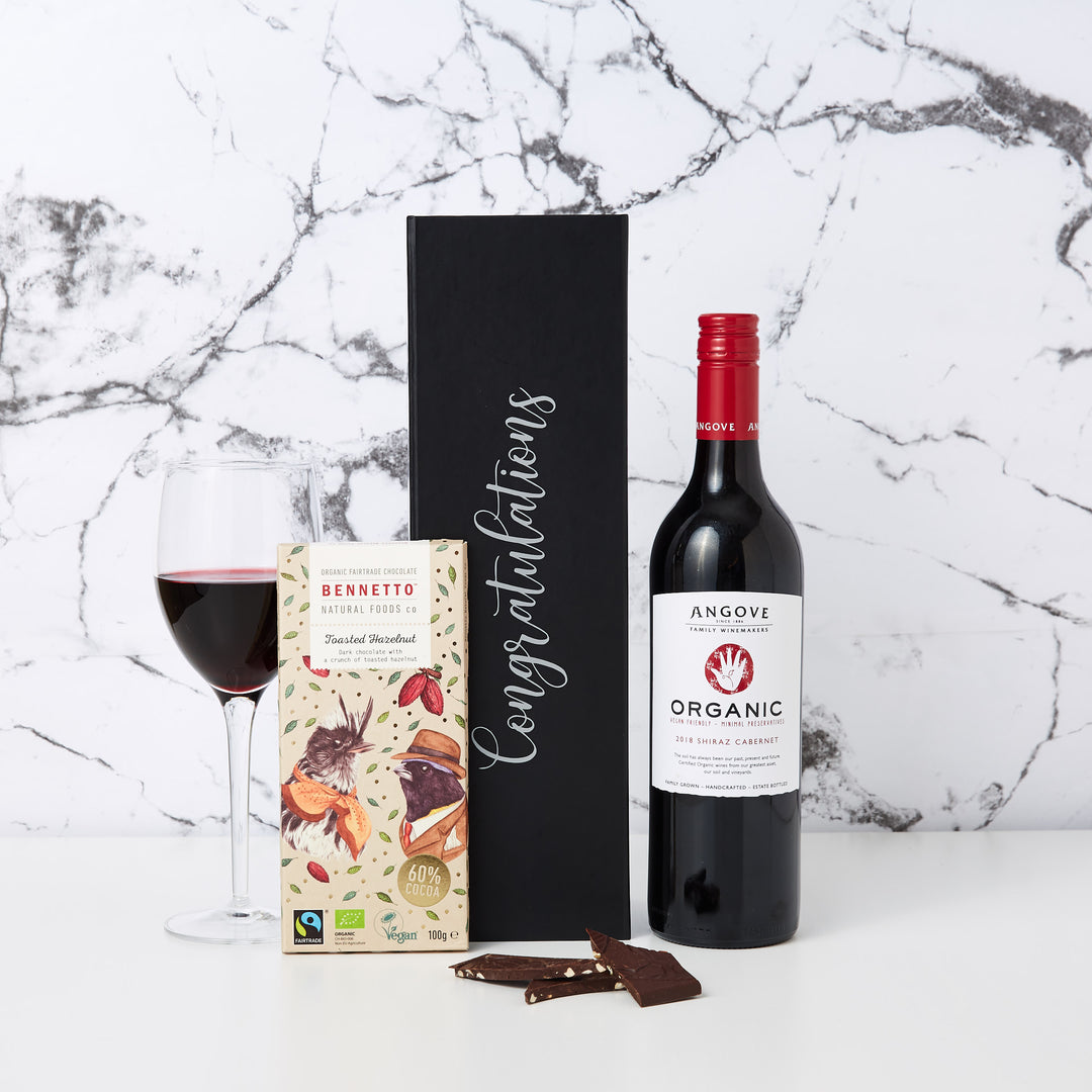 Congratulations Organic Red Wine and Chocolate Hamper is a great gift for your corporate clients. This hamper comes personalised with Congratulations printed in custom decal lettering a bottle of Shiraz Cabernet and a delicious block of Bennetto Chocolate. 