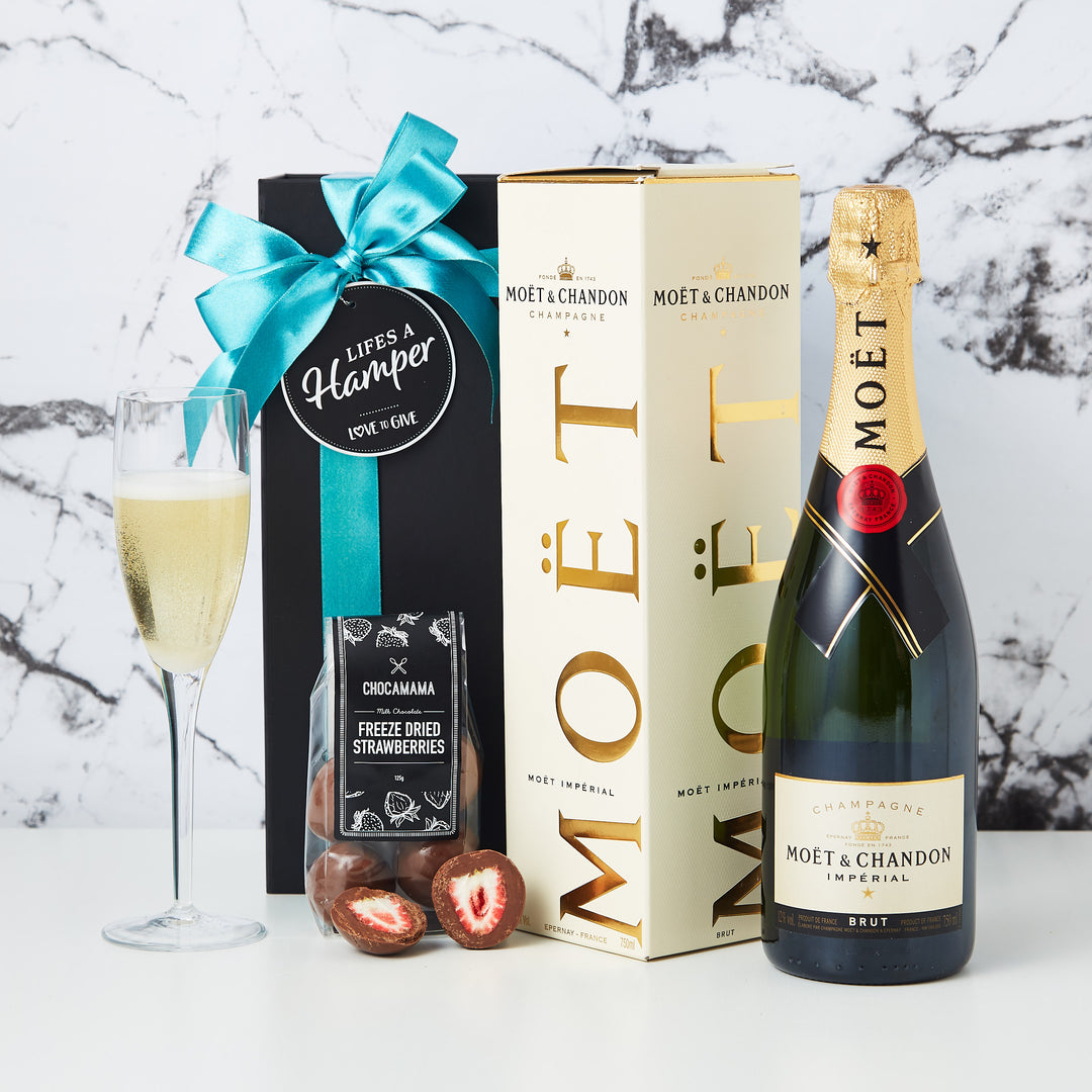 Moet and Chandon Champagne Hamper is the perfect hamper to congratulate a client, friend or family member. The Moet and Chandon hamper comes with a bottle of Moet and Chandon plus a packet of our delicious chocolate coated freeze dried strawberries.