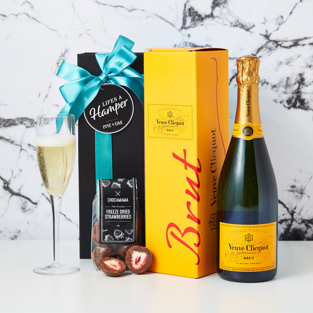Veuve Champagne Hamper comes in our signature black magnetic box, with a Veuve Cliquot and chocolate covered freeze dried strawberries. This hamper is the perfect way to say Congratulations.