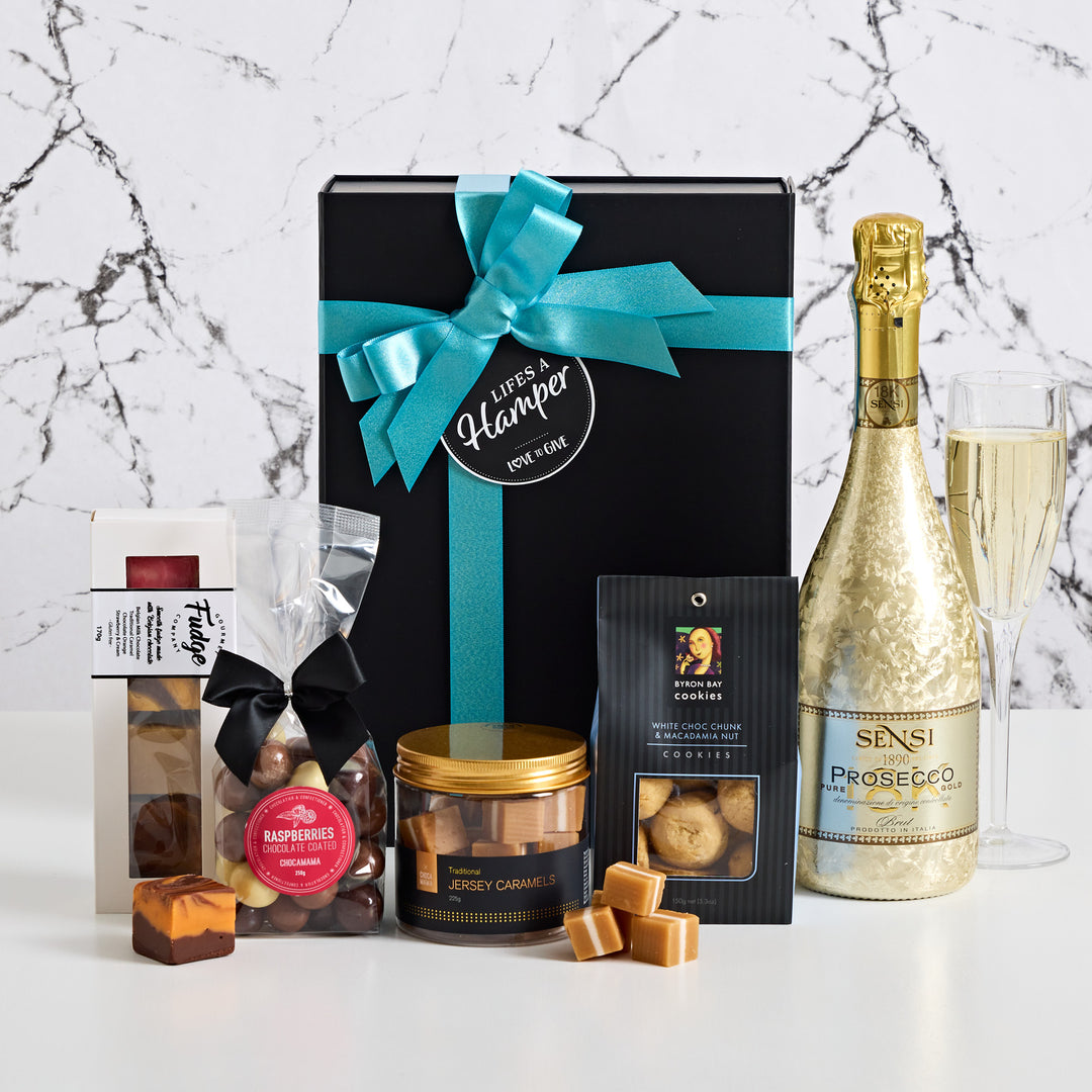 Sensi 18K Prosecco Gift box includes byron bay cookies, chocamama chocolate coated raspberries, gourmet fudge and traditional jersey caramels.